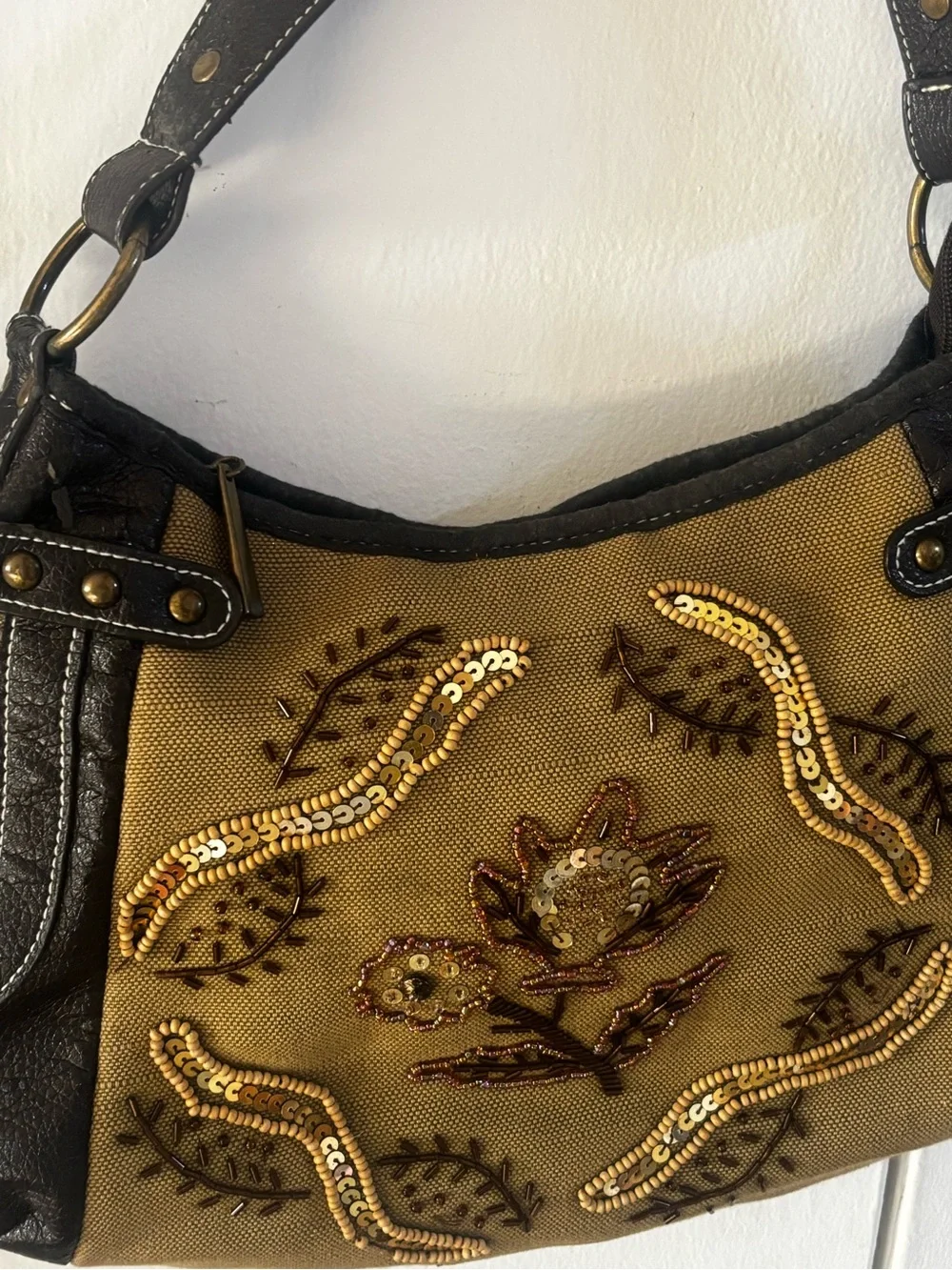 tan canvas and black pebbled leather accented with metallic studs VTG